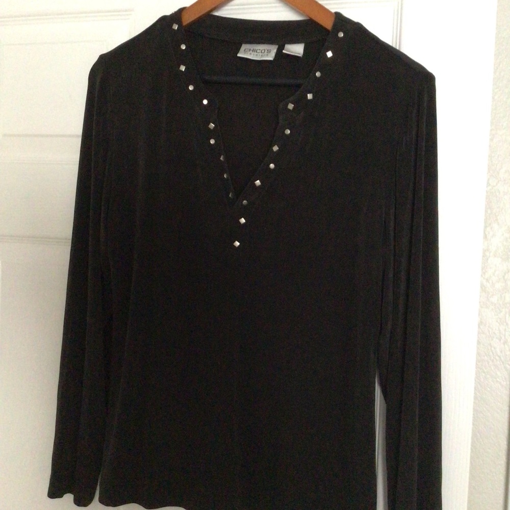 Chicos Black top with silver accent. Chico’s Traveler size 1
Worn twice